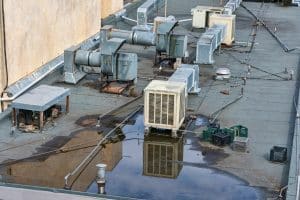 Commercial HVAC system in standing water on roof 